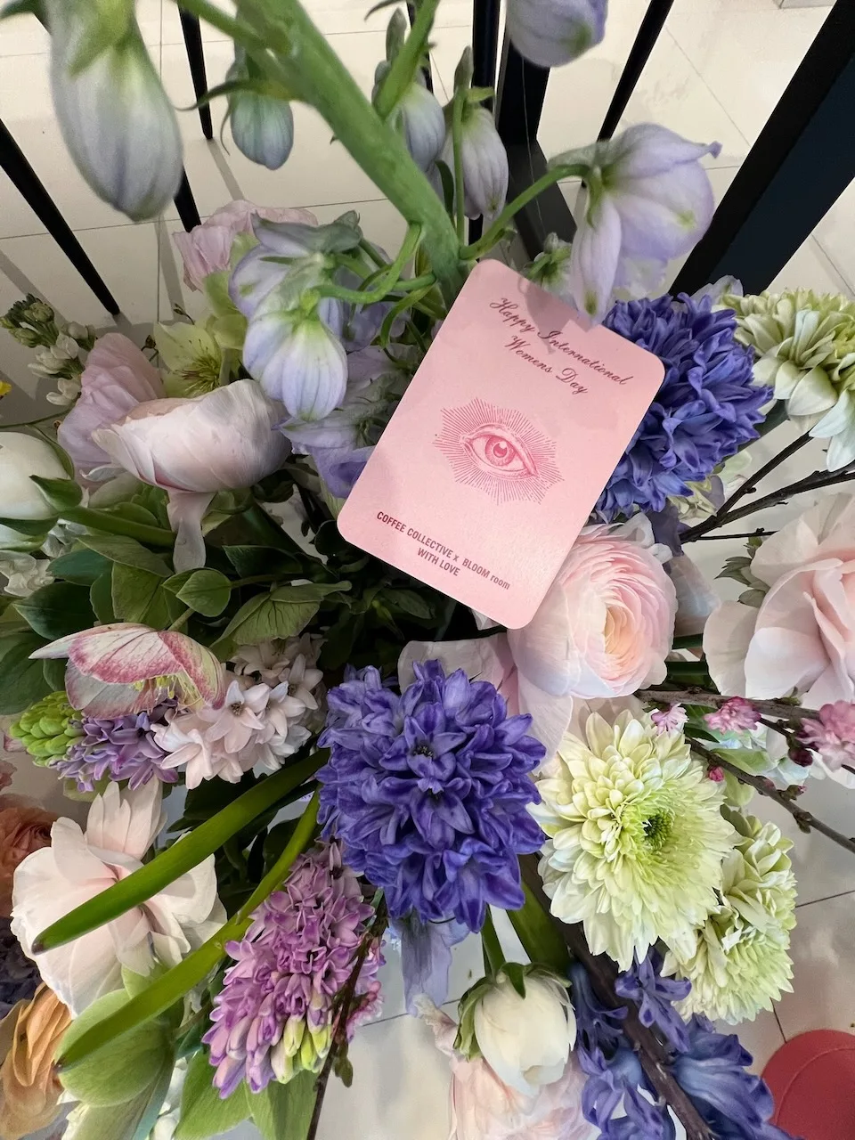 Lavender, hyacinth and ranunculus arrangement with gift card by Bloom Room Studio