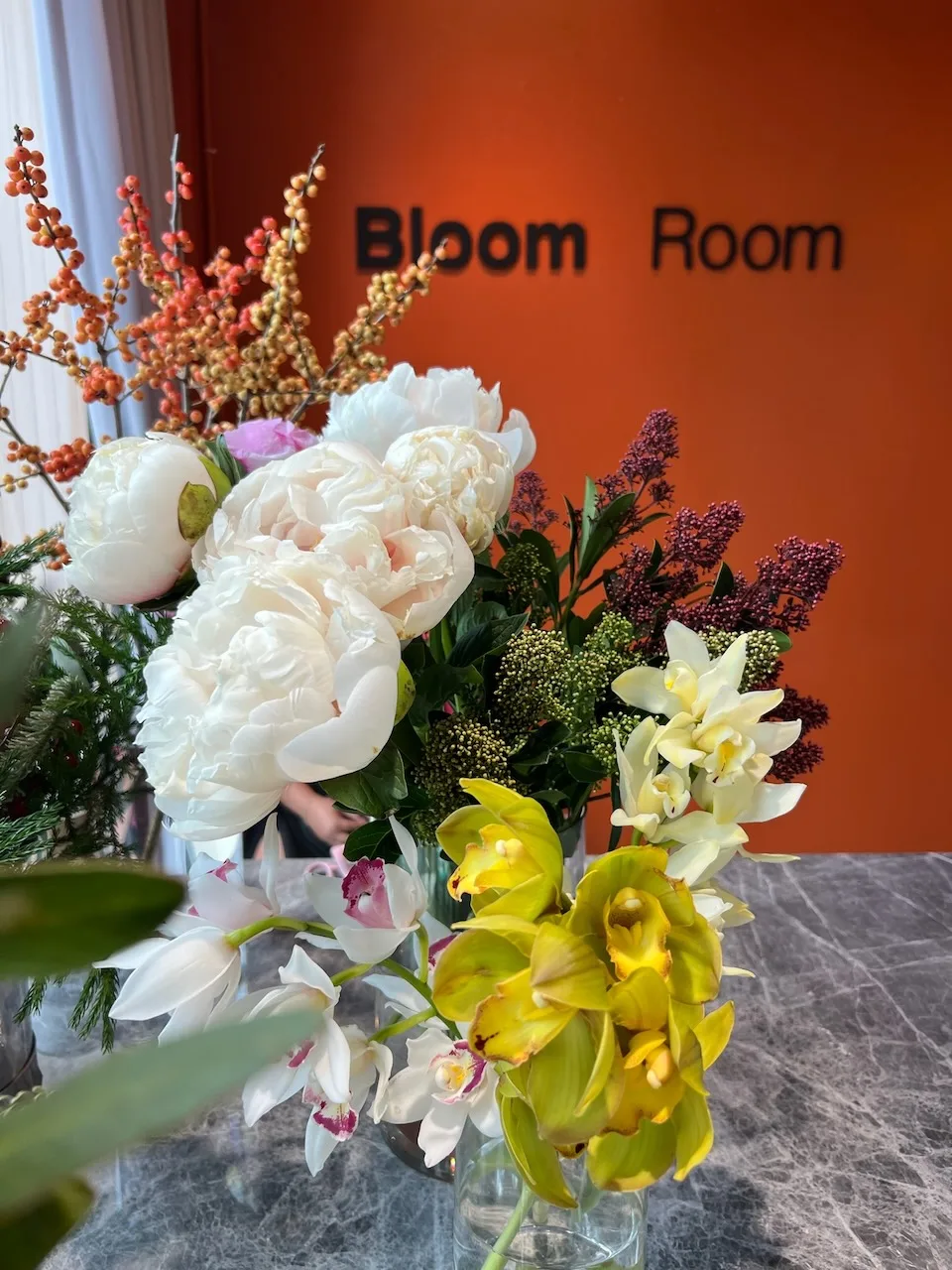 Peony and orchid arrangement composed at the studio