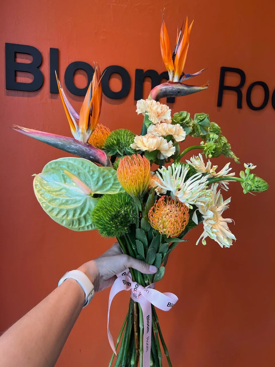 Tropical hand-tied bouquet with birds of paradise, anthurium and pincushion proteas by Bloom Room Studio, Koh Samui