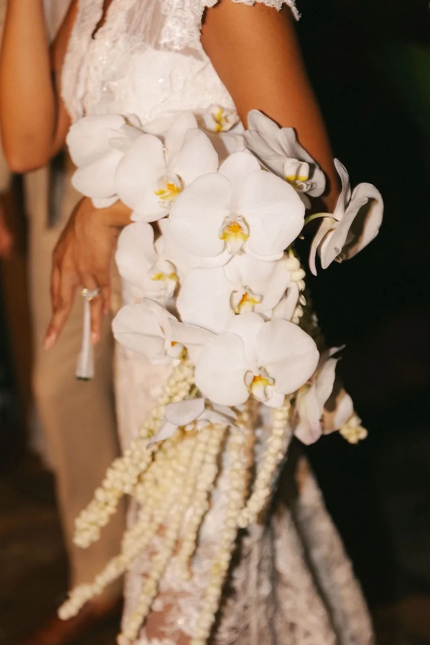 Cascading bridal bouquet of white phalaenopsis orchids with trailing amaranthus