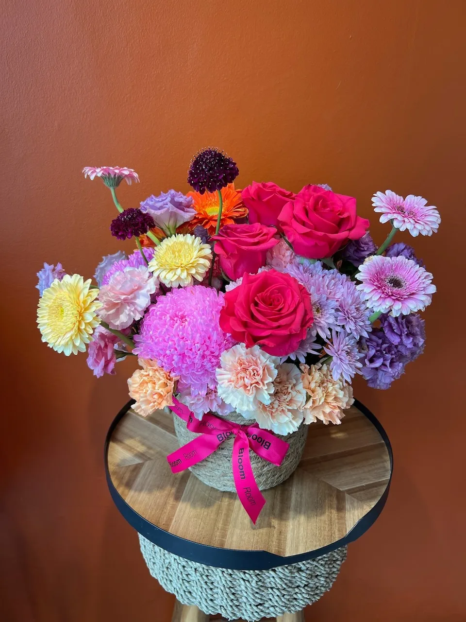 Soft white box with white roses, phalaenopsis orchids, and scabiosa stems